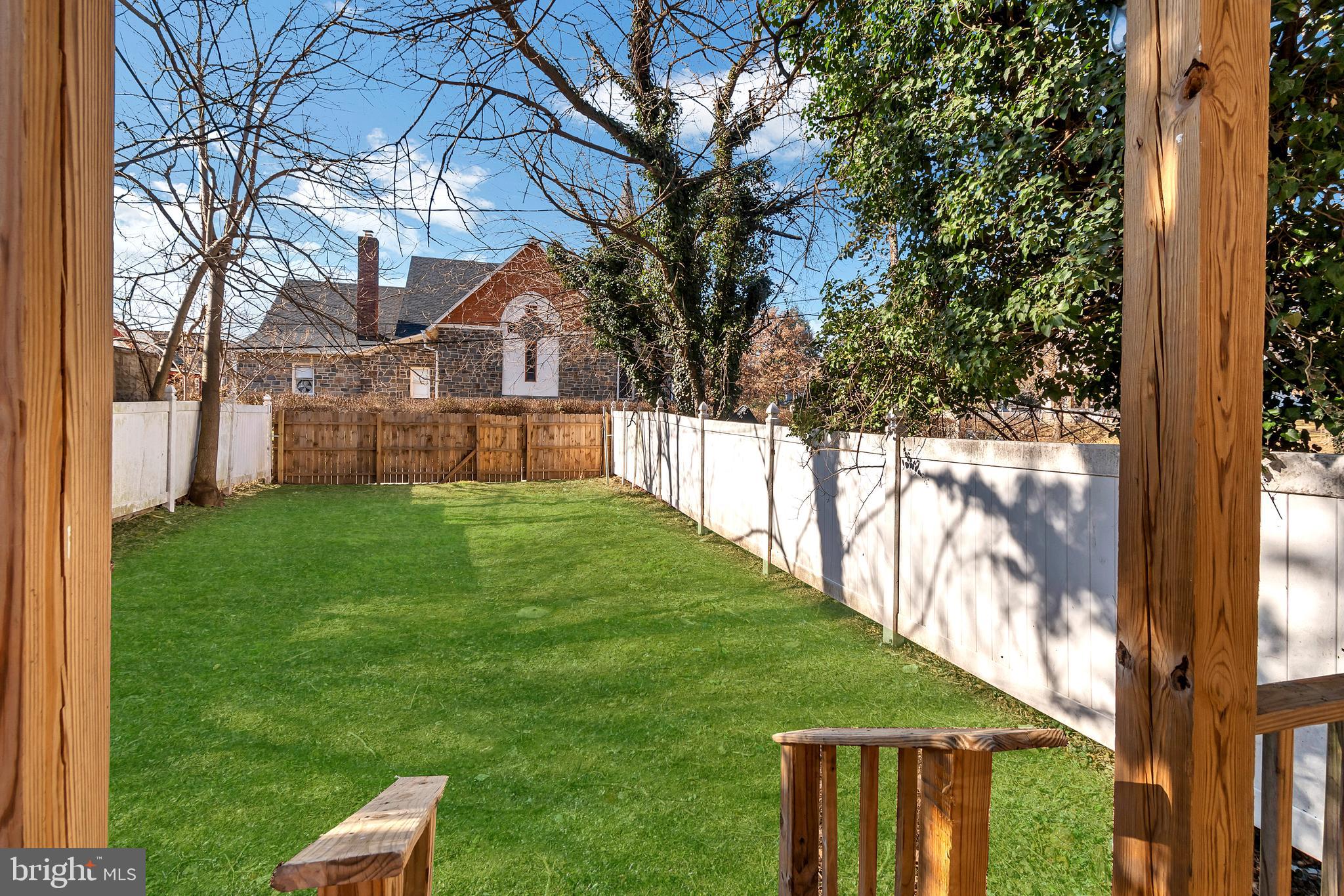 12 South Augusta Avenue Baltimore, MD 21229 - Photo 16 of 38 a view of a house with a yard