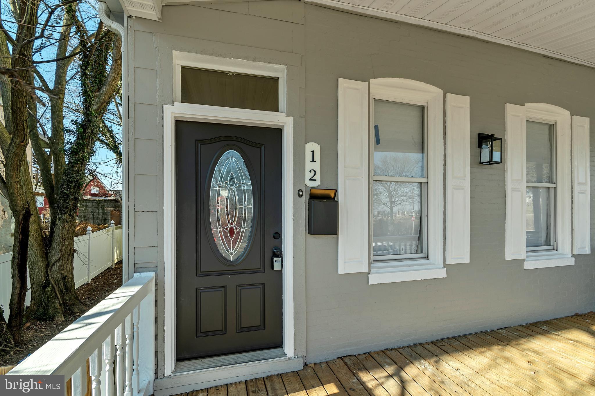 12 South Augusta Avenue Baltimore, MD 21229 - Photo 23 of 38 a view of a hallway with entryway wooden floor and a livingroom