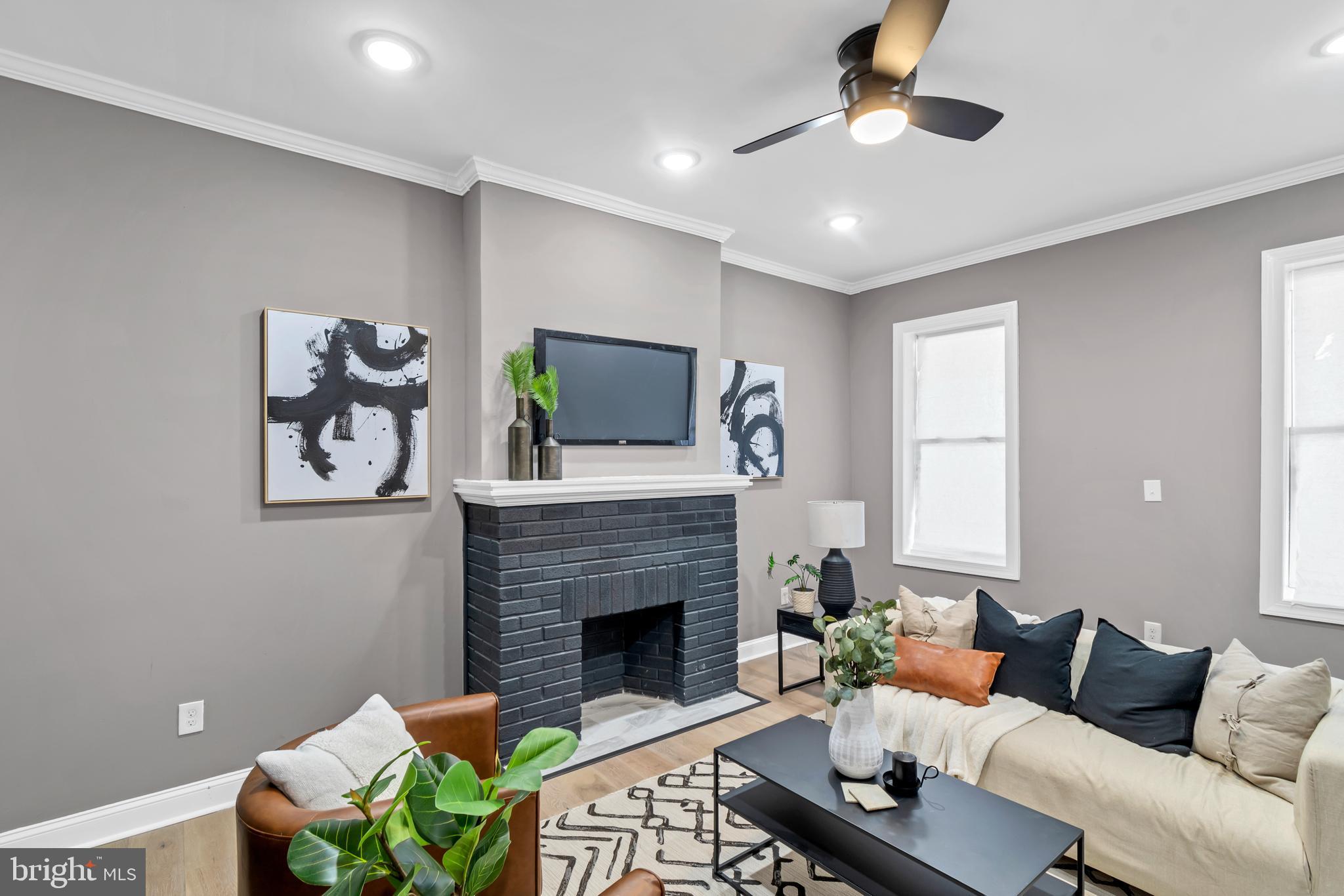12 South Augusta Avenue Baltimore, MD 21229 - Photo 24 of 38 a living room with furniture and a fireplace