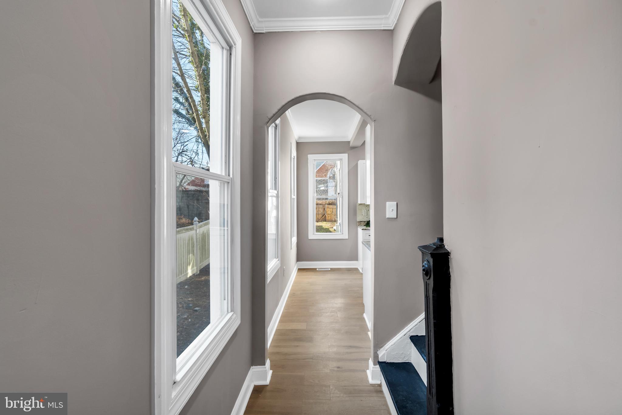 12 South Augusta Avenue Baltimore, MD 21229 - Photo 26 of 38 a view of a room with wooden floor mirror and windows