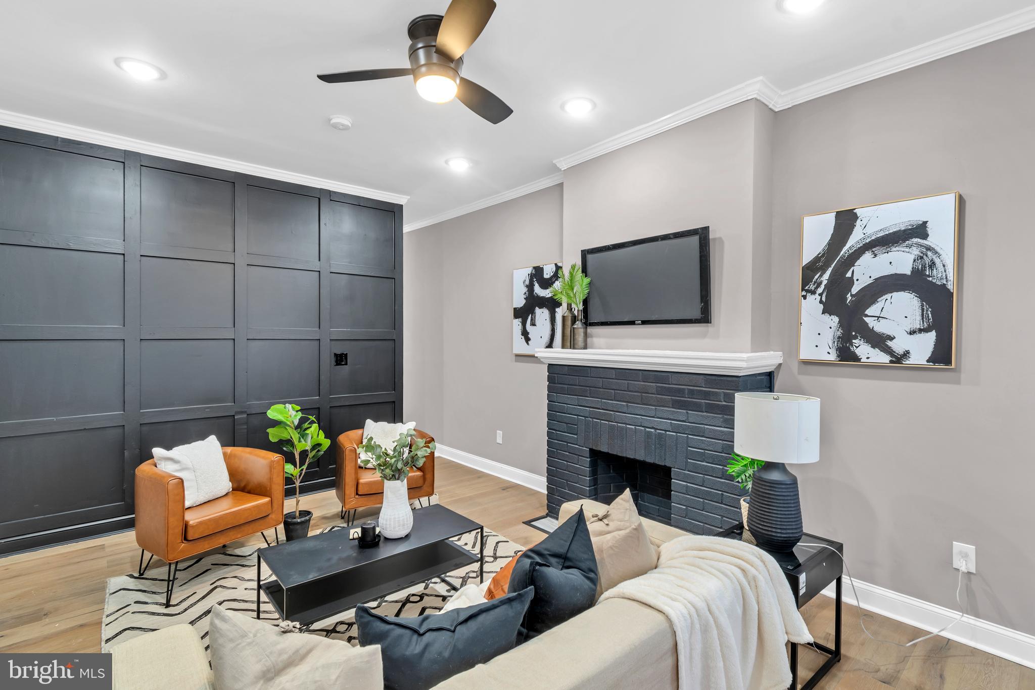 12 South Augusta Avenue Baltimore, MD 21229 - Photo 3 of 38 a living room with furniture and a fireplace