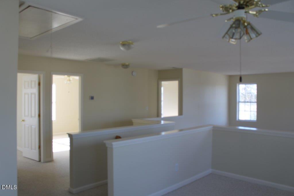 4717 Delta Lake Drive Raleigh, NC 27612 - Photo 12 of 20 a room that has a window in it
