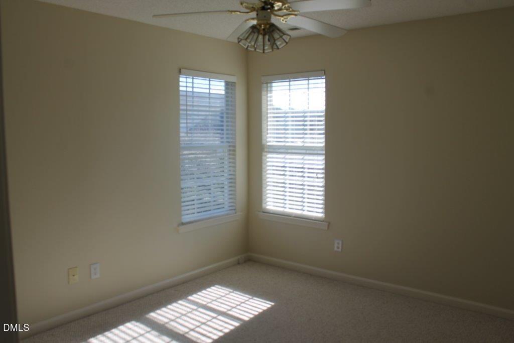 4717 Delta Lake Drive Raleigh, NC 27612 - Photo 15 of 20 a view of an empty room with a window
