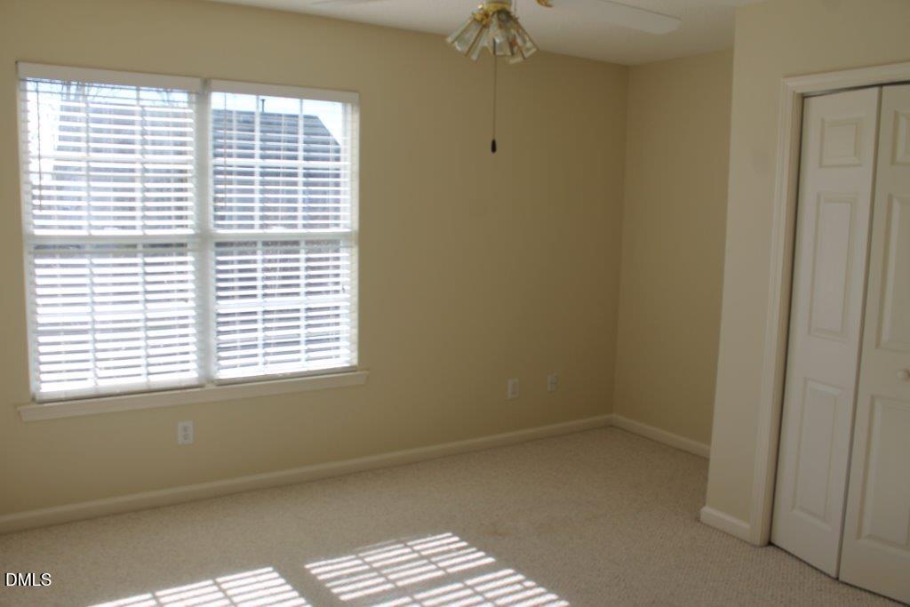 4717 Delta Lake Drive Raleigh, NC 27612 - Photo 16 of 20 a view of an empty room and a window
