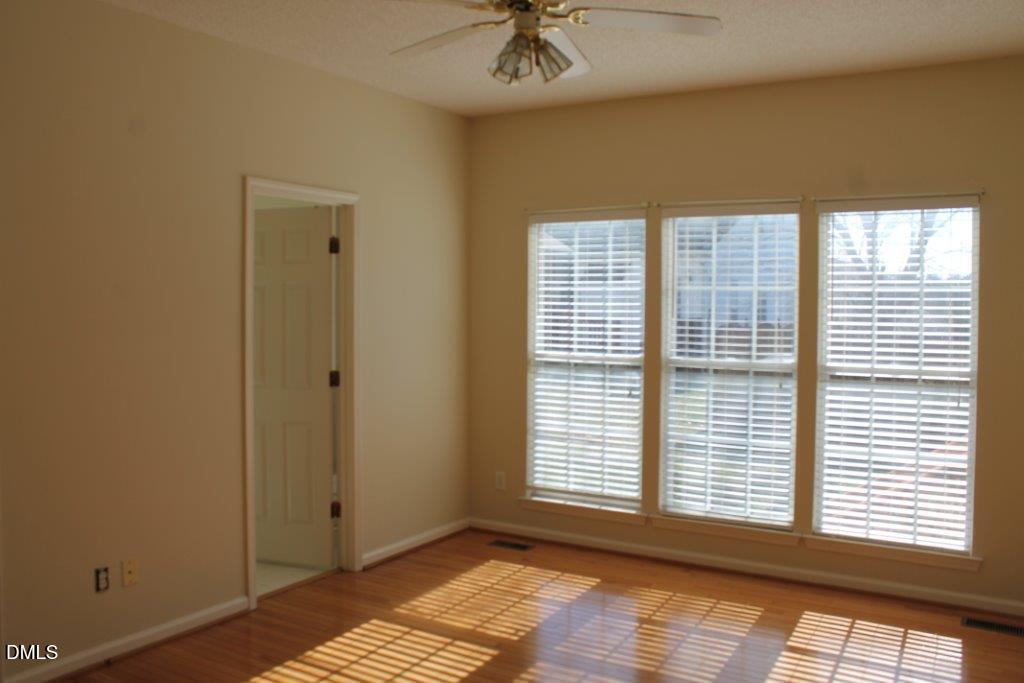 4717 Delta Lake Drive Raleigh, NC 27612 - Photo 8 of 20 a view of an empty room with a window