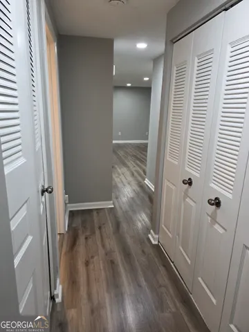 a view of entryway with wooden floor