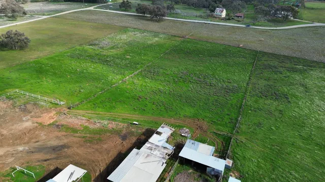 a view of a golf course with chairs