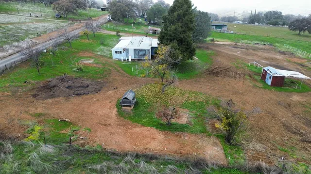 an aerial view of a house with garden