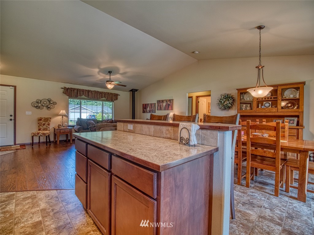 5125 180th Trail Southwest Rochester, WA 98579 - Photo 14 of 25 a kitchen with stainless steel appliances granite countertop a sink counter space and cabinets