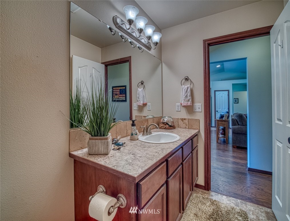 5125 180th Trail Southwest Rochester, WA 98579 - Photo 15 of 25 a bathroom with a sink and a mirror