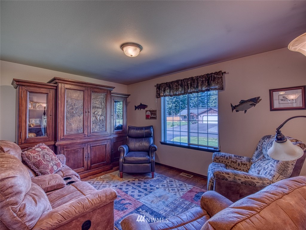 5125 180th Trail Southwest Rochester, WA 98579 - Photo 18 of 25 a living room with furniture and a window