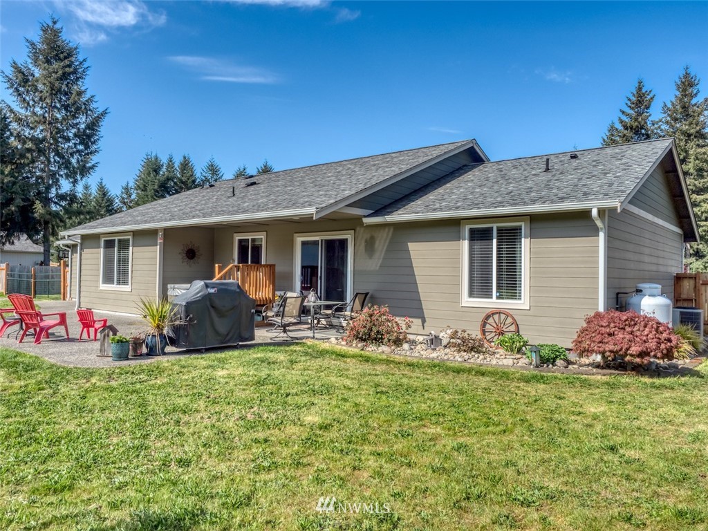 5125 180th Trail Southwest Rochester, WA 98579 - Photo 3 of 25 a front view of house with yard patio and green space