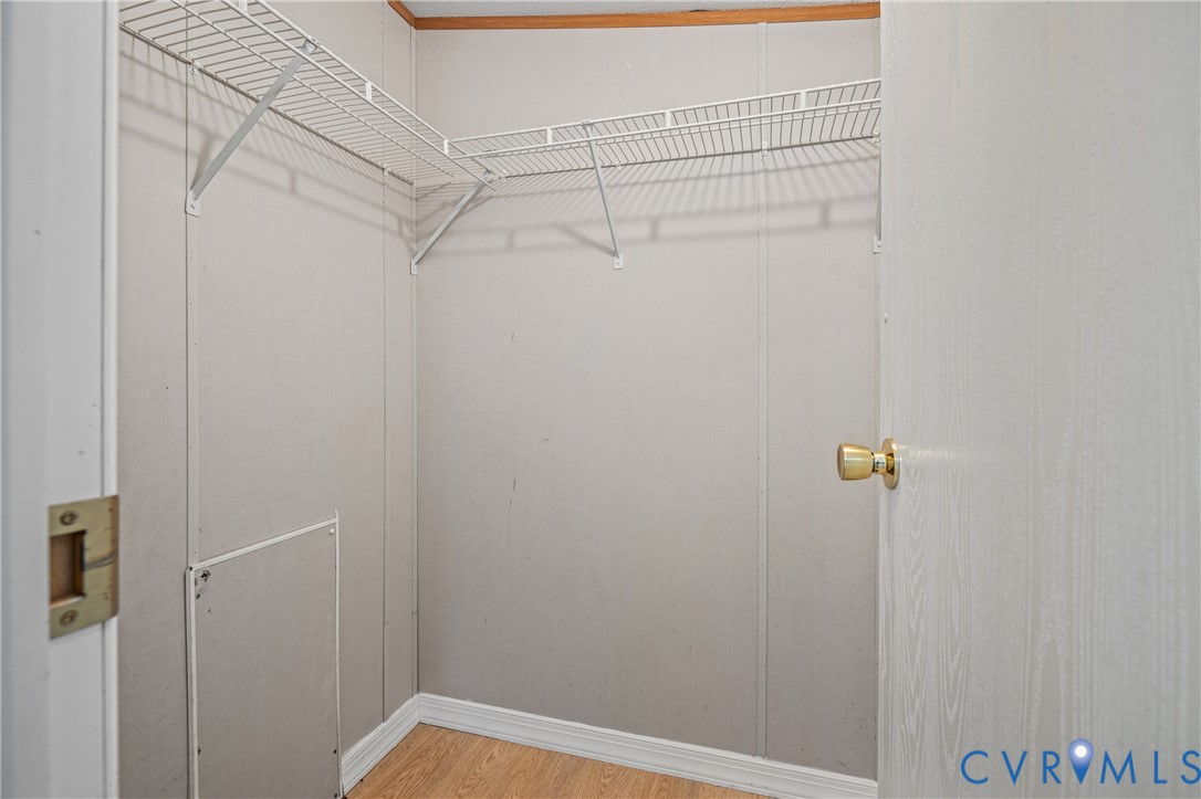 14306 Wilkinson Road Dewitt, VA 23840 - Photo 30 of 60 Walk-in closet with wire shelving and wood-finish