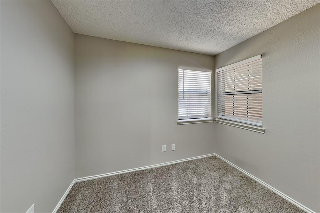 3920 Winston Drive Denton, TX 76210 - Photo 16 of 20 Unfurnished room featuring carpet floors and a textured ceiling