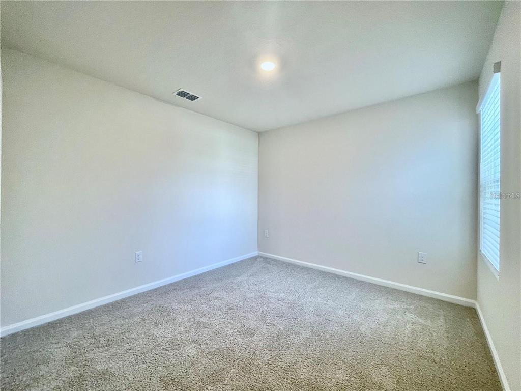 199 Redbud Road Palm Coast, FL 32137 - Photo 12 of 23 a view of an empty room