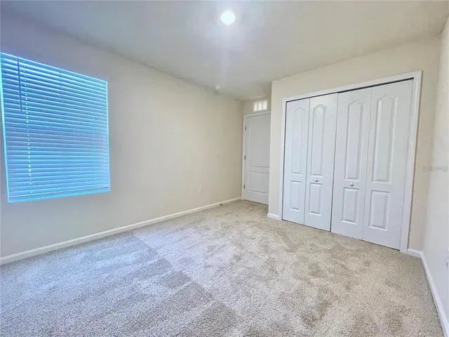 an empty room with mirror