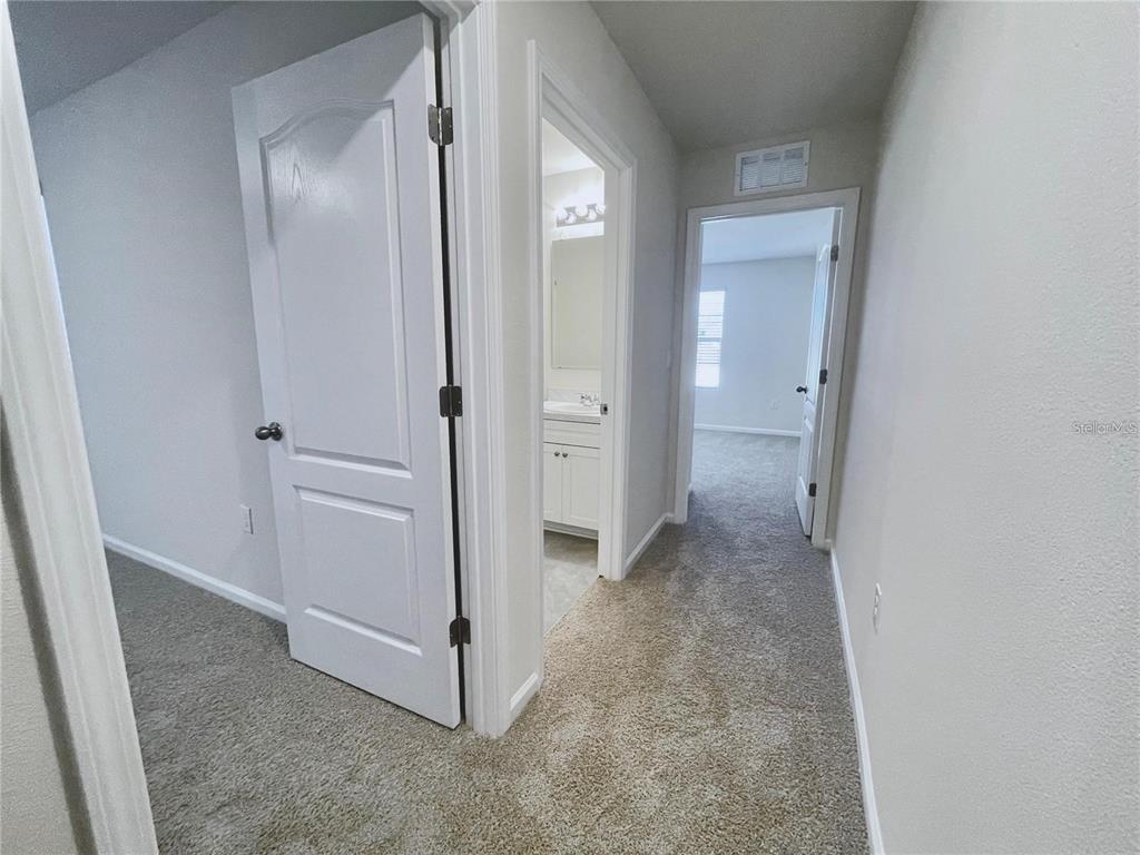 199 Redbud Road Palm Coast, FL 32137 - Photo 16 of 23 an empty room with mirror