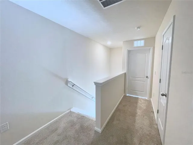 a view of two chairs in the balcony