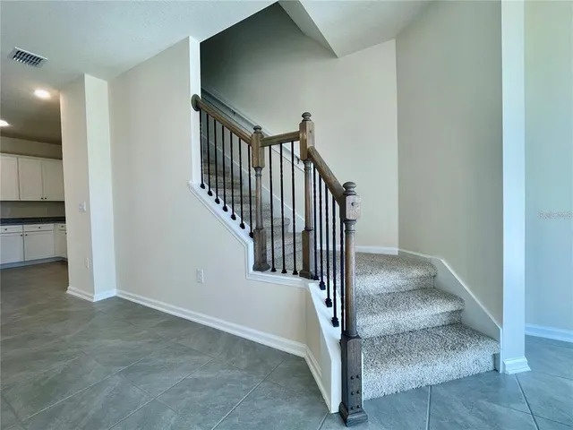 a view of a hallway with staircase