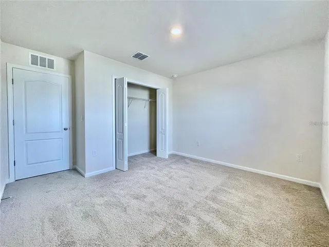 a view of an empty room and entryway