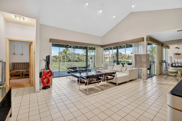 a work room with furniture and a potted plant