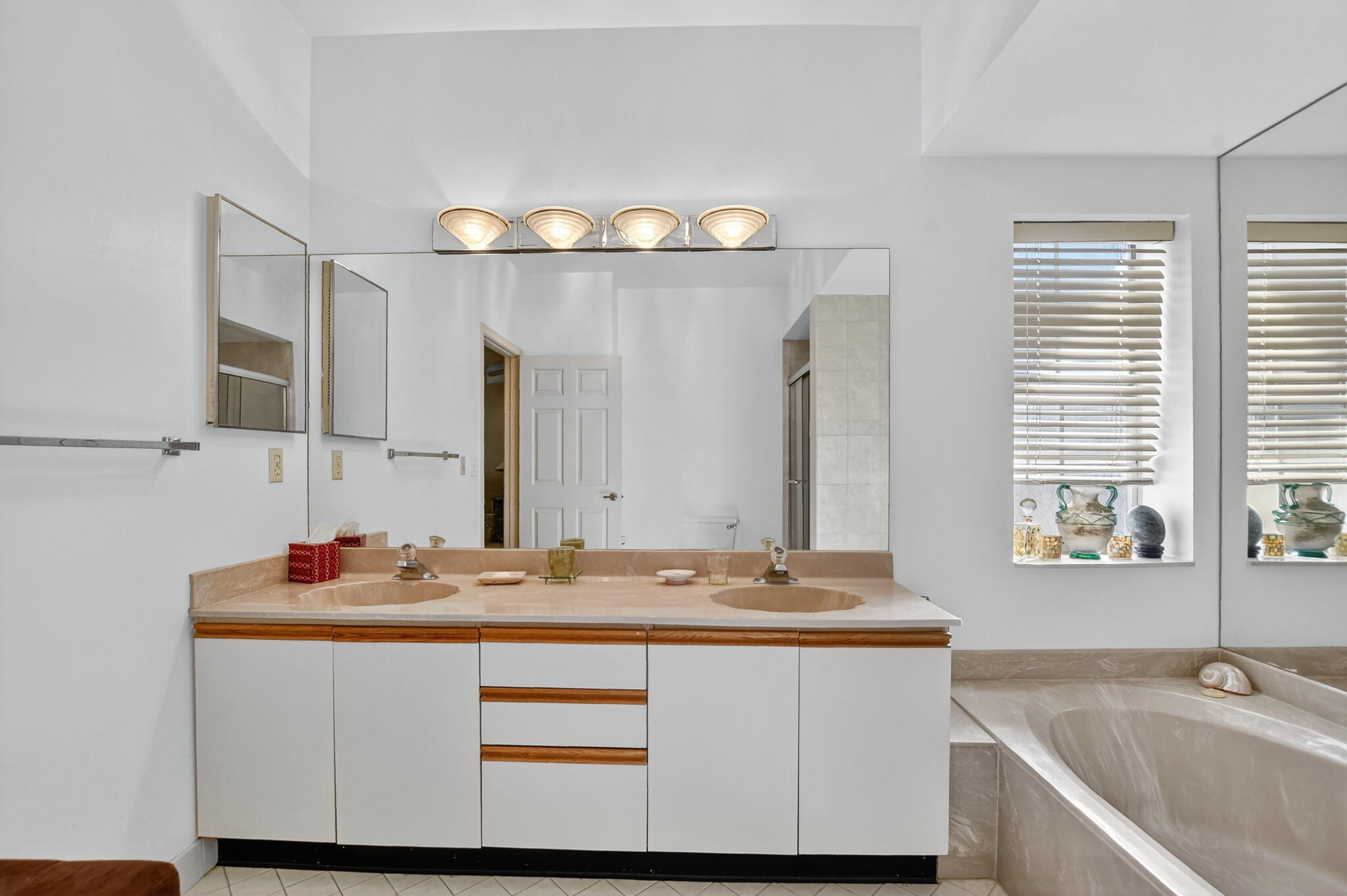 7623 Cinebar Drive, Unit 30U Boca Raton, FL 33433 - Photo 35 of 86 a bathroom with a sink double vanity and a mirror