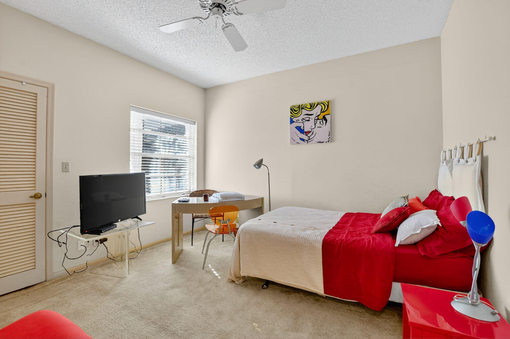 7623 Cinebar Drive, Unit 30U Boca Raton, FL 33433 - Photo 39 of 86 a bedroom with a bed and a flat screen tv