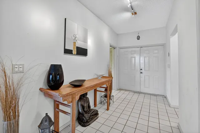 a kitchen with stainless steel appliances a stove a microwave a sink and cabinets