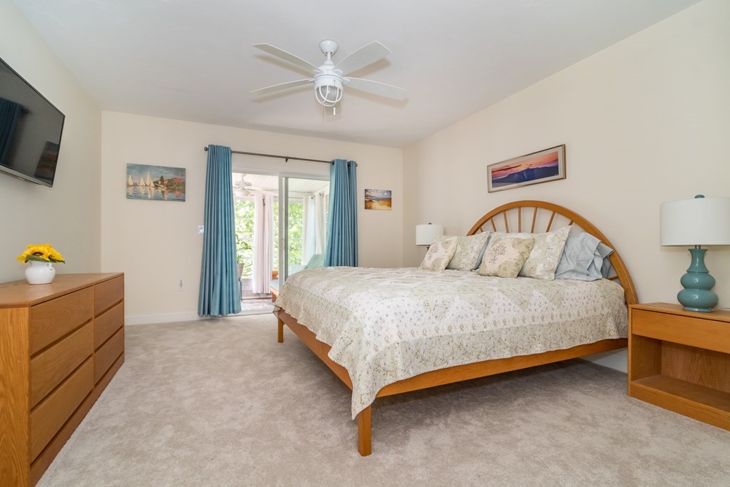 28 Prestwick Road, Unit 188 Bourne, MA 02532 - Photo 16 of 41 a bedroom with a bed and a flat screen tv