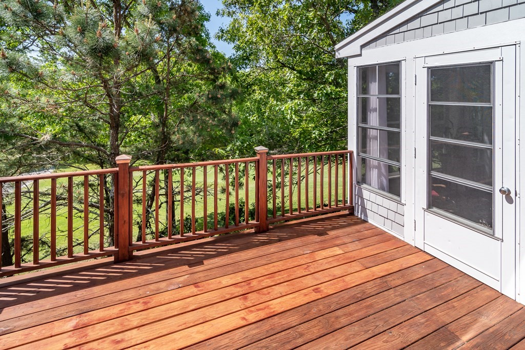 28 Prestwick Road, Unit 188 Bourne, MA 02532 - Photo 28 of 41 a view of balcony with wooden floor and fence
