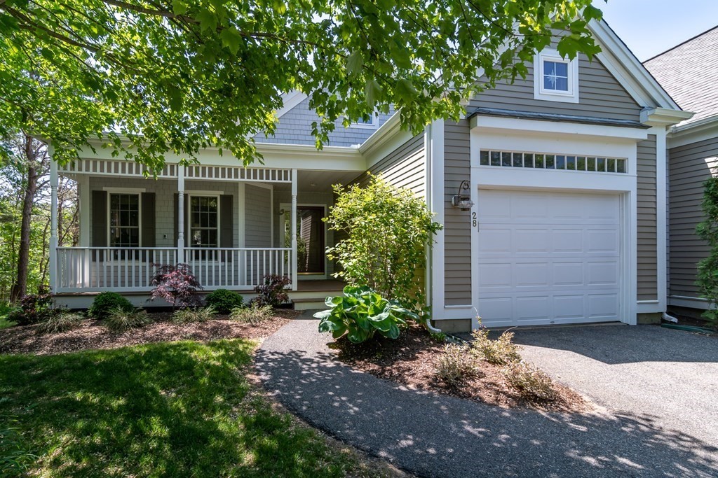 28 Prestwick Road, Unit 188 Bourne, MA 02532 - Photo 3 of 41 a front view of a house with garden