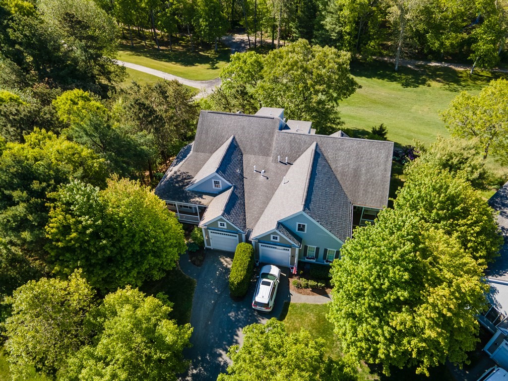 28 Prestwick Road, Unit 188 Bourne, MA 02532 - Photo 31 of 41 an aerial view of a house with a yard swimming pool and outdoor seating