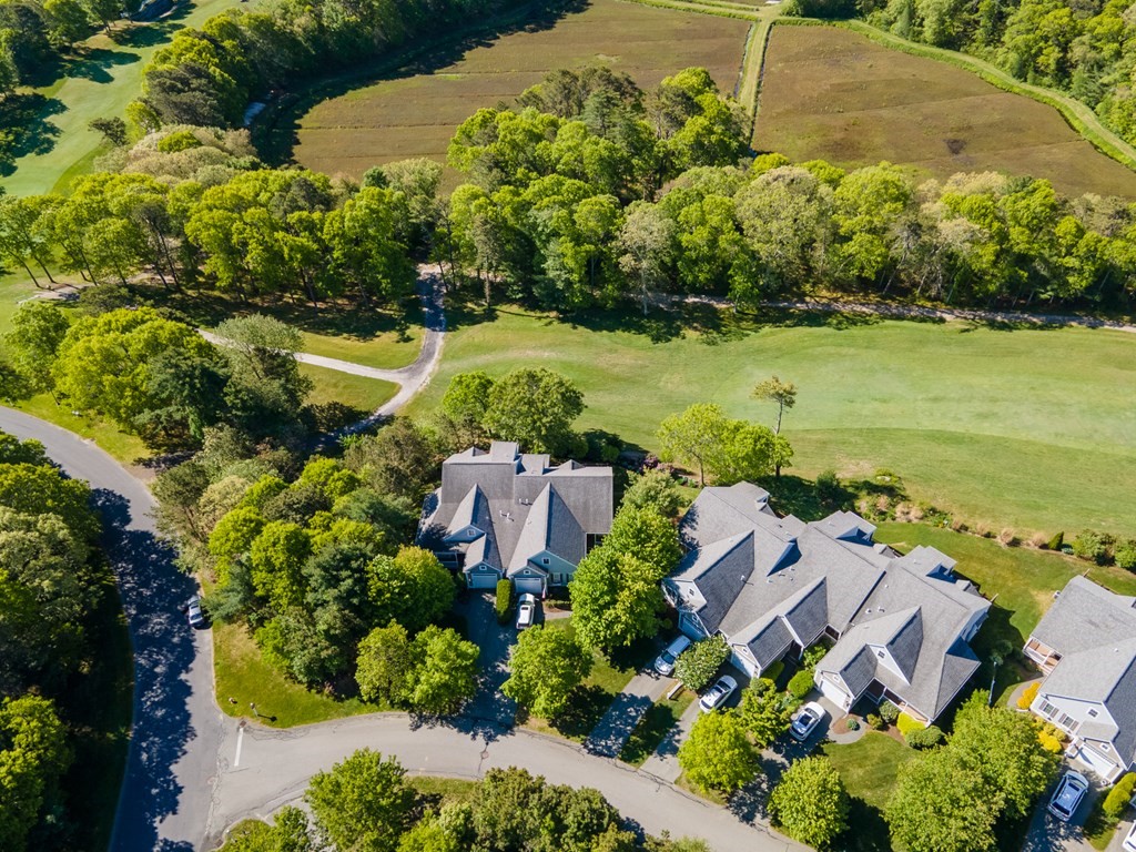 28 Prestwick Road, Unit 188 Bourne, MA 02532 - Photo 32 of 41 an aerial view of a house with a garden