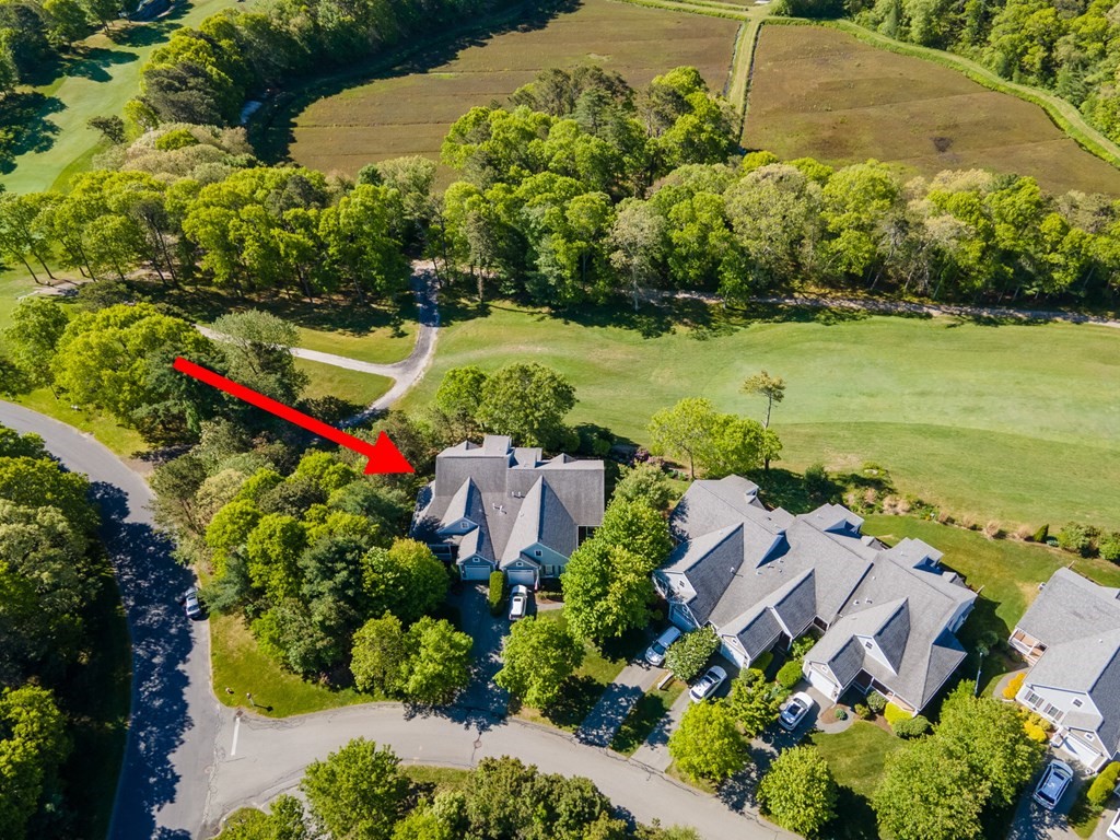28 Prestwick Road, Unit 188 Bourne, MA 02532 - Photo 33 of 41 an aerial view of a house with a yard and lake view