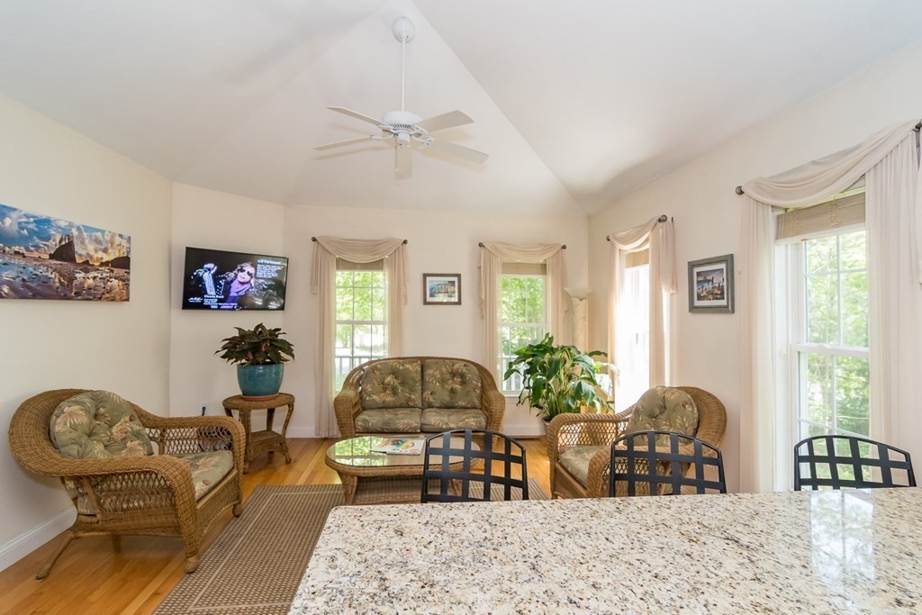 28 Prestwick Road, Unit 188 Bourne, MA 02532 - Photo 6 of 41 a living room with furniture potted plant and a chandelier