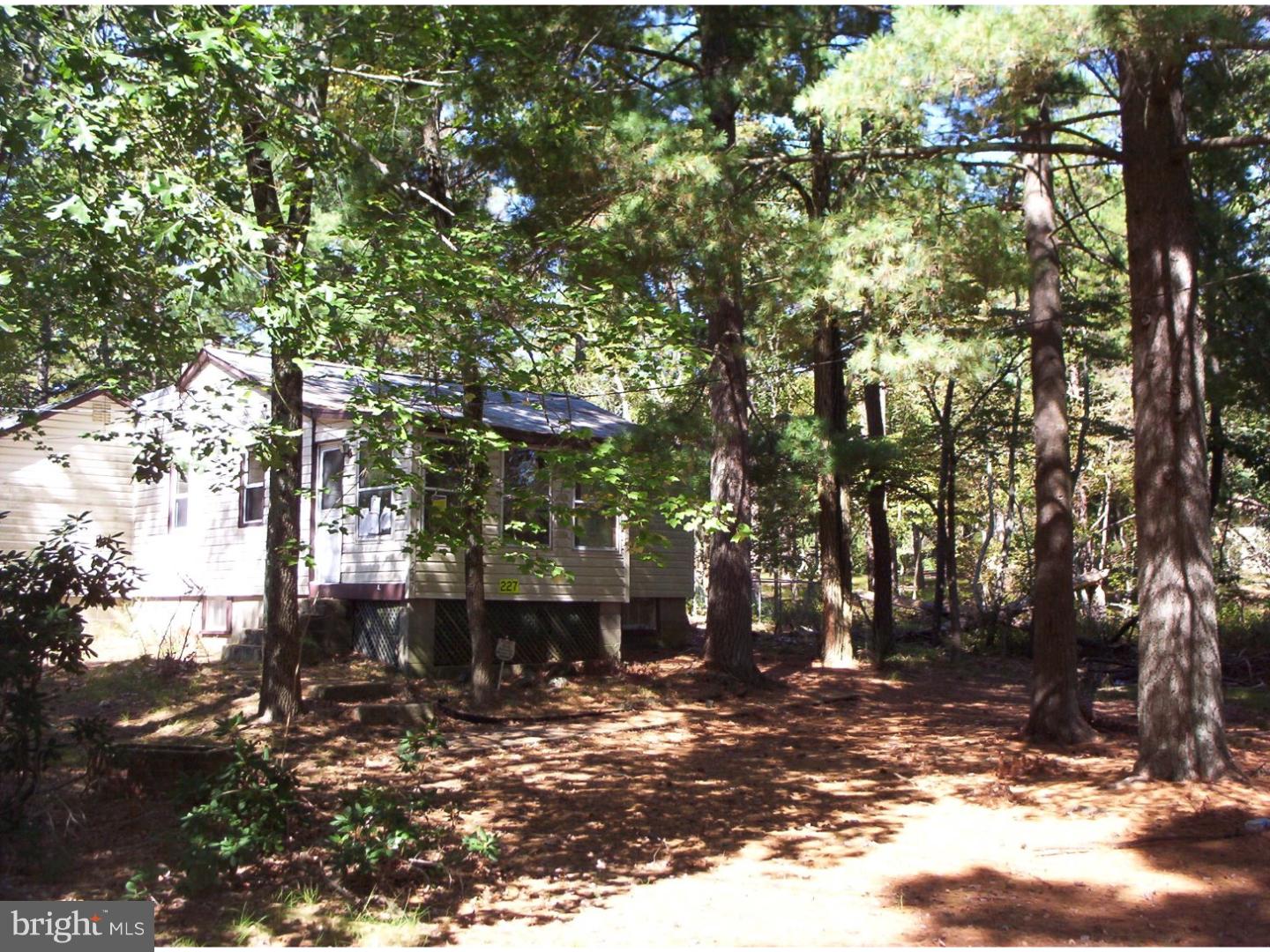 227 Ridge Road Browns Mills, NJ 08015 - Photo 2 of 17 a backyard of a house with lots of green space