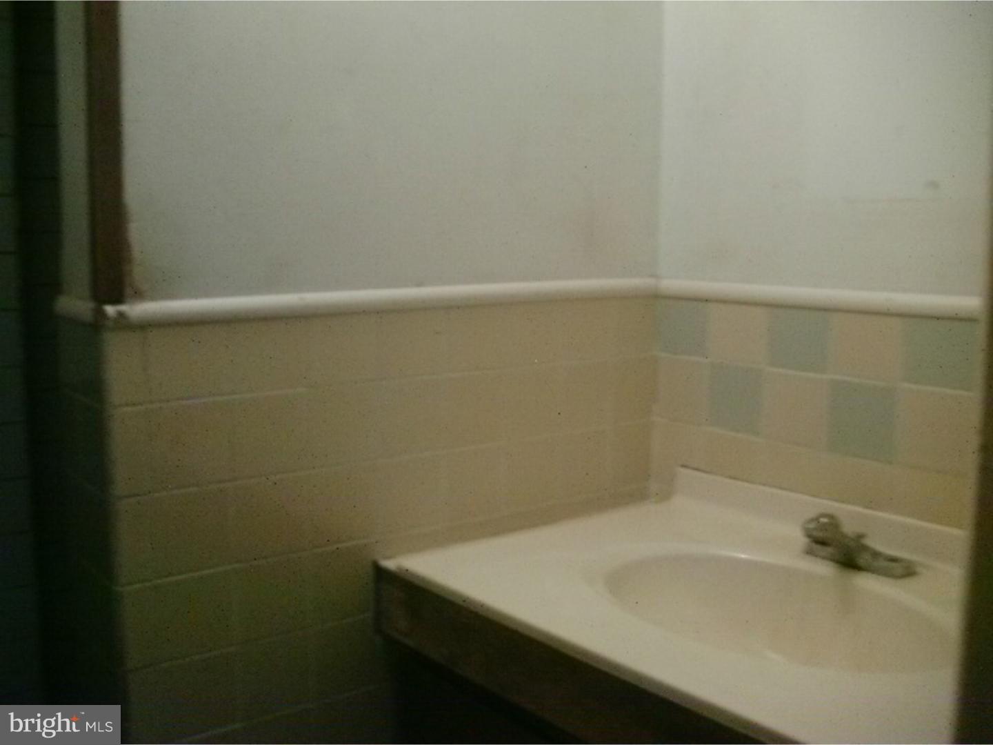 227 Ridge Road Browns Mills, NJ 08015 - Photo 13 of 17 a bathroom with a sink and a mirror