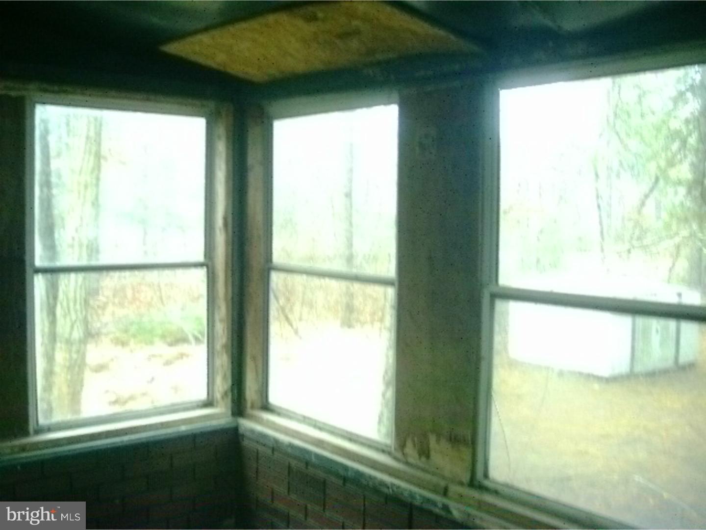 227 Ridge Road Browns Mills, NJ 08015 - Photo 14 of 17 a view of an empty room with a window
