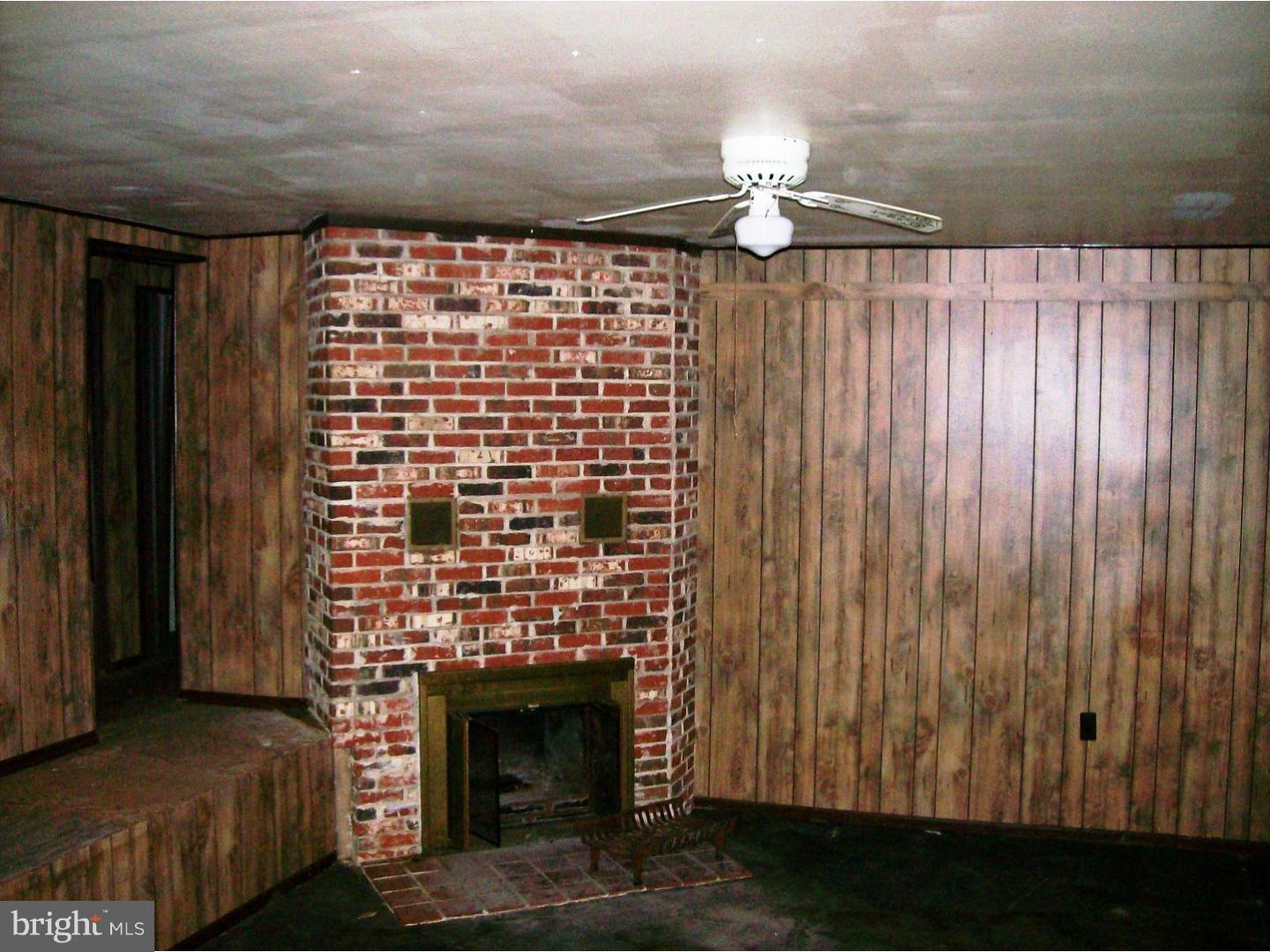 227 Ridge Road Browns Mills, NJ 08015 - Photo 3 of 17 a view of fireplace and wooden floor
