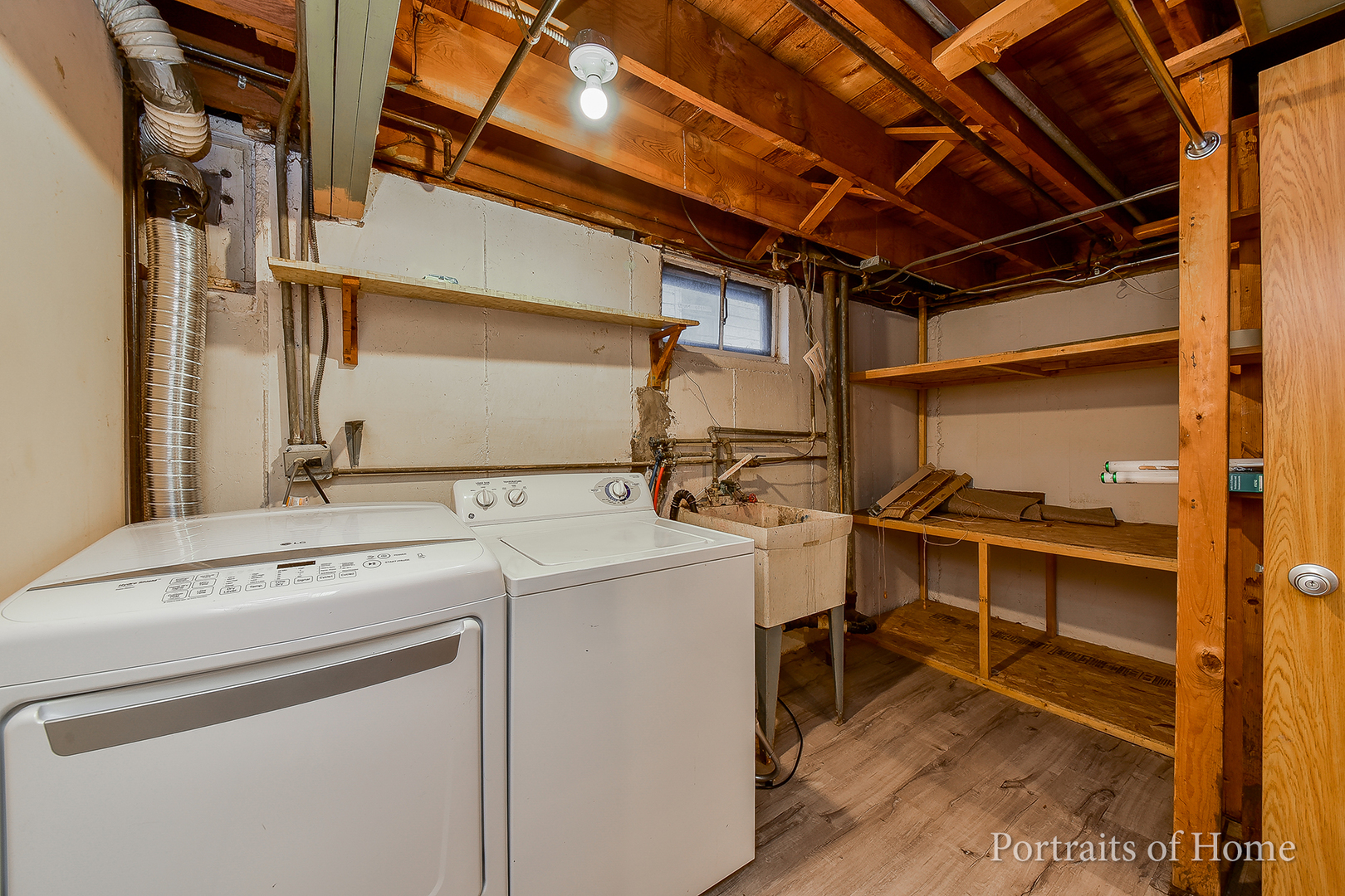 437 Austin Street Downers Grove, IL 60515 - Photo 13 of 16 a view of storage and utility room with washer and dryer
