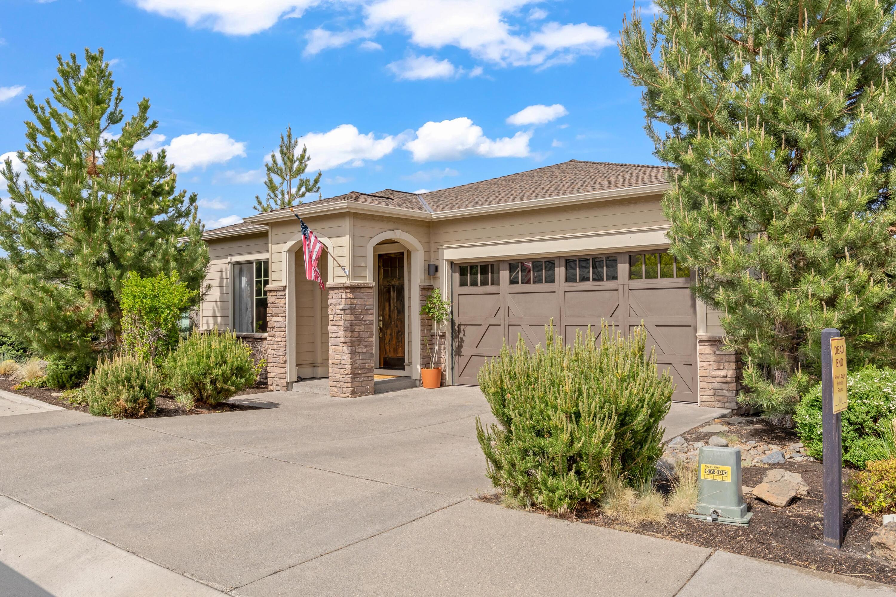 2375 Northwest Majestic Ridge Drive Bend, OR 97703 - Photo 20 of 28 a front view of a house with garden