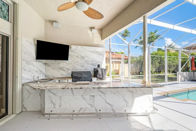 a view of a room with wooden floor and floor to ceiling window