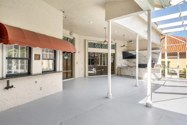an aerial view of a house with a swimming pool yard and outdoor seating