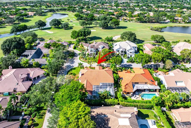 an aerial view of residential house with outdoor space and swimming pool