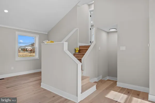 a spacious bedroom with a balcony a bed and a couch