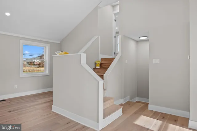 a spacious bedroom with a balcony a bed and a couch