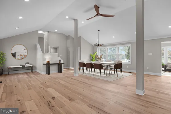 a kitchen with kitchen island sink and refrigerator