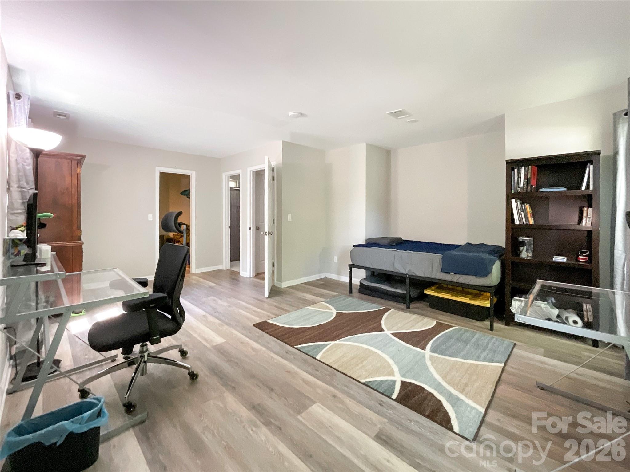 2113 Killarney Place Charlotte, NC 28262 - Photo 11 of 19 a living room with furniture a air conditioner and a table