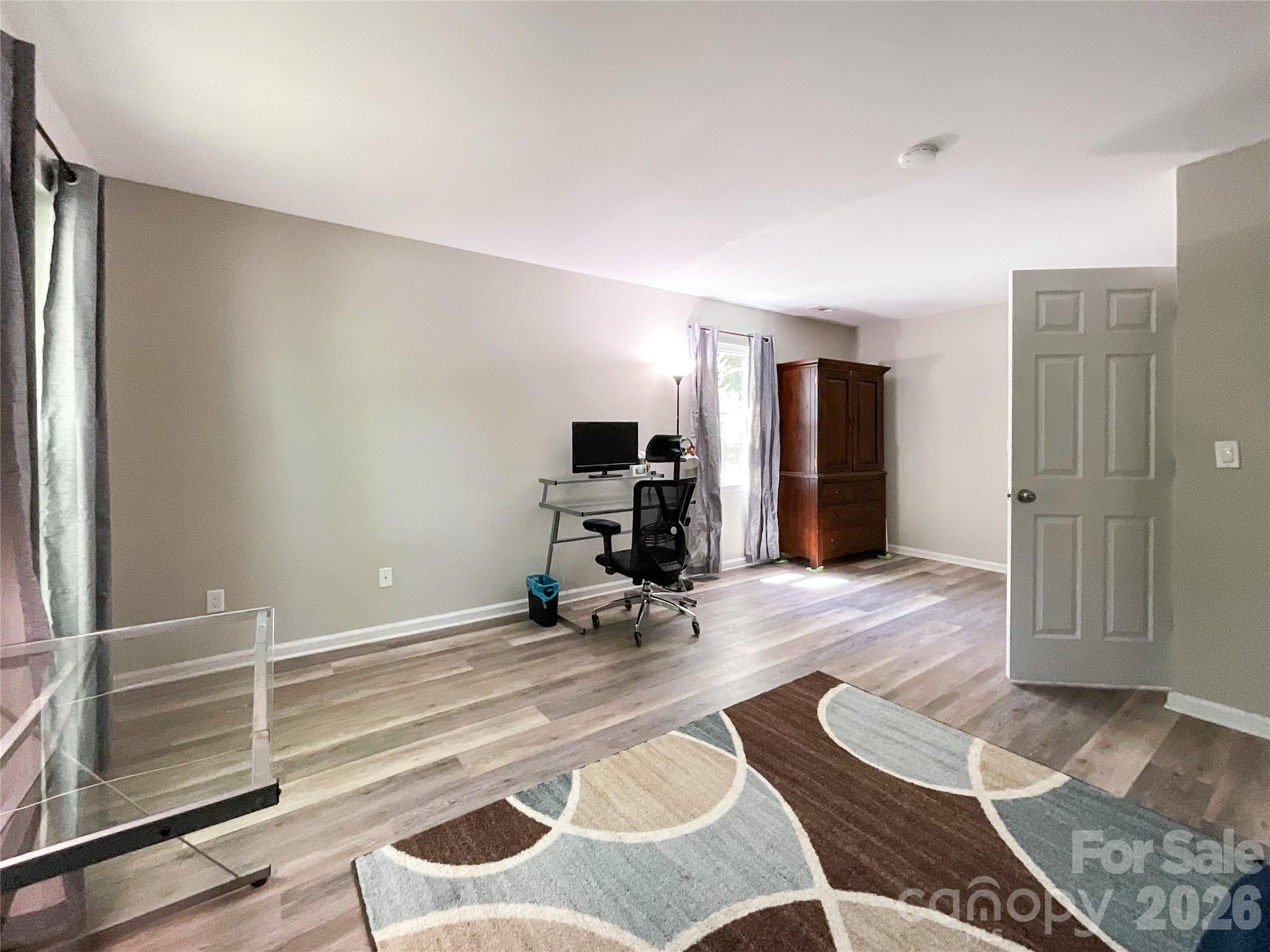 2113 Killarney Place Charlotte, NC 28262 - Photo 12 of 19 a view of a livingroom with furniture and an empty room