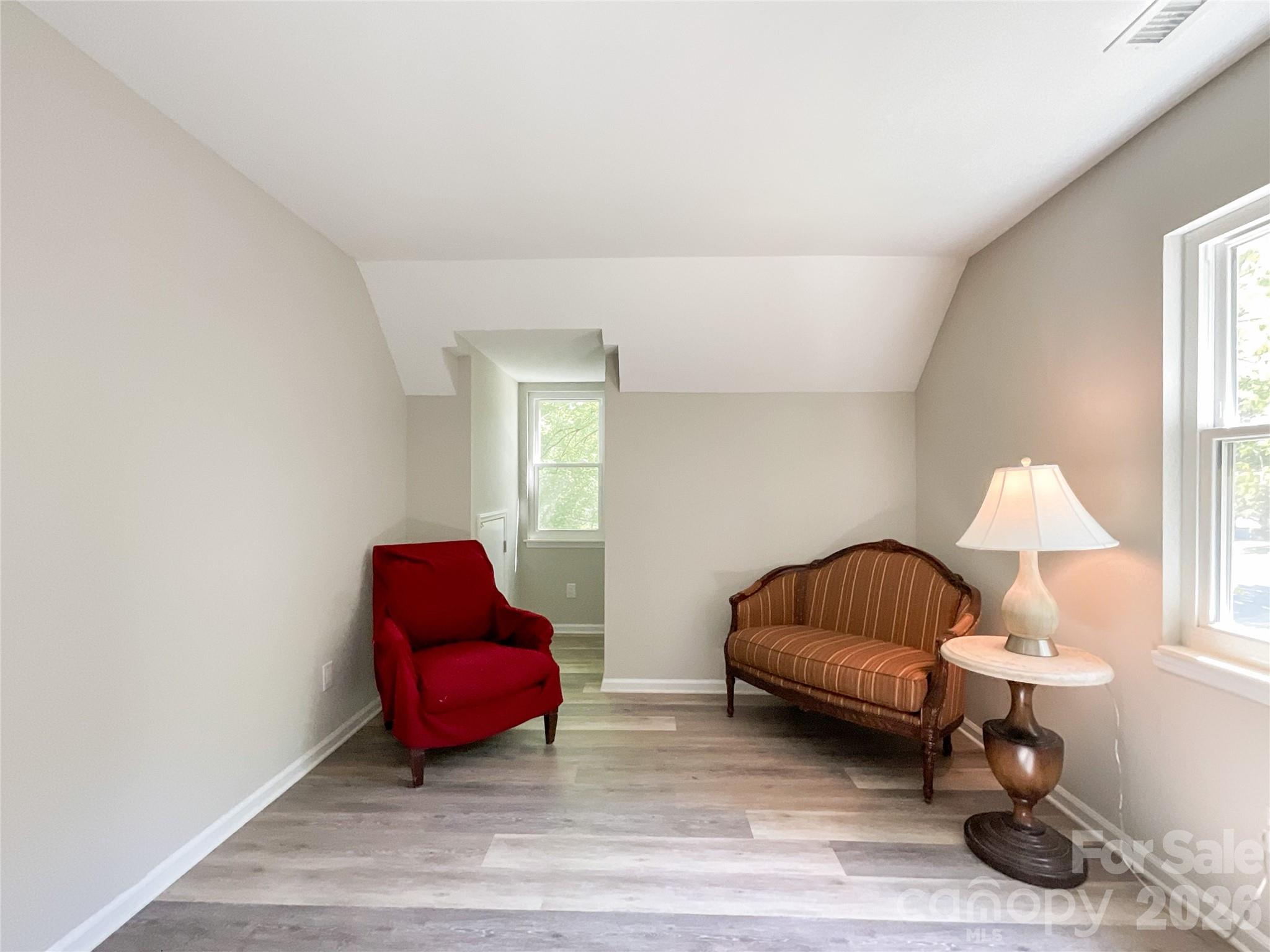 2113 Killarney Place Charlotte, NC 28262 - Photo 16 of 19 a bedroom with furniture and a lamp